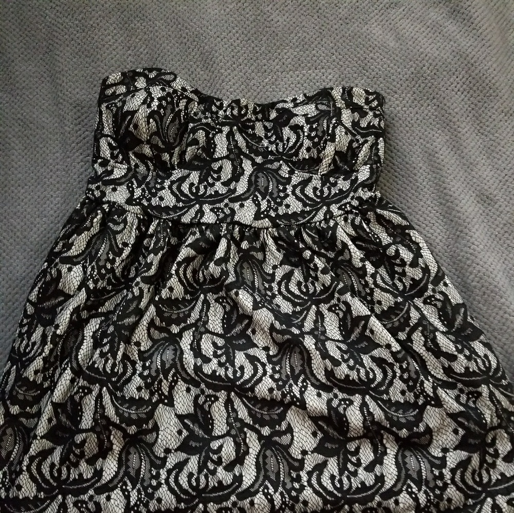 Black lace strapless dress.